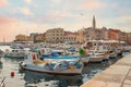 Lovely harbor of tourist resort Rovinj, with colorful boats, morning scenery