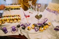 Lovely heart on the stick is placed in the cupcake. The dessert wedding table.