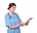 Lovely hispanic nurse working on a tablet pc Royalty Free Stock Photo