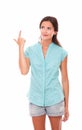 Lovely hispanic woman in blue blouse pointing up Royalty Free Stock Photo