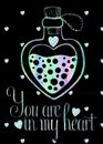 Lovely holographic greetings card on black background with holographic magic heart shaped bottle.