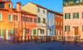 Lovely house facade and colorful walls in Burano, Venice. Burano island canal, colorful houses and boats, Venice landmark, Italy. Royalty Free Stock Photo