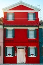 Lovely house facade and colorful walls in Burano, Venice. Burano island canal, colorful houses and boats, Venice landmark, Italy. Royalty Free Stock Photo