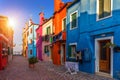 Lovely house facade and colorful walls in Burano, Venice. Burano island canal, colorful houses and boats, Venice landmark, Italy. Royalty Free Stock Photo