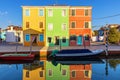 Lovely house facade and colorful walls in Burano, Venice. Burano island canal, colorful houses and boats, Venice landmark, Italy. Royalty Free Stock Photo