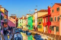 Lovely house facade and colorful walls in Burano, Venice. Burano island canal, colorful houses and boats, Venice landmark, Italy. Royalty Free Stock Photo