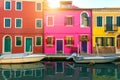 Lovely house facade and colorful walls in Burano, Venice. Burano island canal, colorful houses and boats, Venice landmark, Italy. Royalty Free Stock Photo