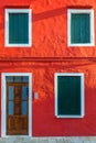 Lovely house facade and colorful walls in Burano, Venice. Burano island canal, colorful houses and boats, Venice landmark, Italy. Royalty Free Stock Photo