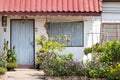 Lovely house front with closed window and flowers, little maisonette and cottage