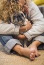Lovely hug human and animal for pet therapy or domestic dog love and kind woman at home - real scene adult lady and old domestic Royalty Free Stock Photo