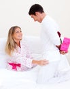 Lovely husband giving a present to his wife Royalty Free Stock Photo