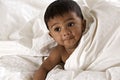 Lovely Indian baby lying on blanket