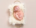 Lovely infant in a flowery hairband, topview