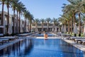 Lovely inside yard of luxurious hotel in Egypt with swimming pools territory, surrounded with palm trees