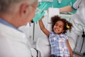 Lovely kid with dentist after repairing teeth Royalty Free Stock Photo