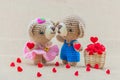 Lovely kissing baby bears crochet doll with hearts basket Royalty Free Stock Photo