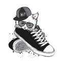 Lovely kitten sitting in sneakers. Vector illustration.