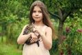 Lovely kitty. small girl hold cute cat in hands. kid love her pet. human and animals. love and care. fluffy kitten in Royalty Free Stock Photo