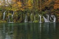 Lovely landscape with beautiful waterfall and autumn forest Royalty Free Stock Photo