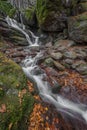 Lovely landscape with beautiful waterfall and autumn forest Royalty Free Stock Photo