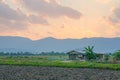 Lovely landscape of countryside hills and valleys with setting sun lighting up side of hills whit sun beams through dramatic cloud Royalty Free Stock Photo