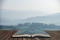 Lovely landscape image of the Peak District in England on a hazy Winter day in pages of open book, story telling concept
