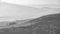 Lovely landscape image of the Peak District in England on a hazy Winter day viewed from the lower slopes of Bamford Edge in black Royalty Free Stock Photo