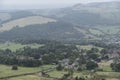 Lovely landscape image of a small village in the Peak District National Park on a misty morning in the English countryside Royalty Free Stock Photo