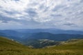 Lovely landscape of Trans?arpathia with beech forest on hills and gorgeous Svydovets mountain ridge. Carpathian Mountains Royalty Free Stock Photo