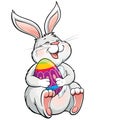 Lovely laughing bunny holding painted easter egg
