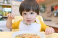 Lovely little boy eats soup Royalty Free Stock Photo