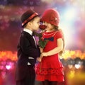 Lovely little boy giving a rose to girl Royalty Free Stock Photo