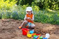 Lovely little boy playing with sand on playground Royalty Free Stock Photo