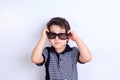 Lovely little boy in sunglasses, studio shoot on white. Children Royalty Free Stock Photo