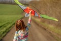 Lovely little girl flying kite Royalty Free Stock Photo