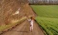 Lovely little girl flying kite Royalty Free Stock Photo