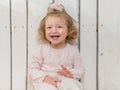 Lovely little girl with funny hairstyle laughing