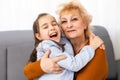 Lovely little girl with her grandmother looking at the camera Royalty Free Stock Photo