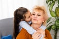 Lovely little girl with her grandmother looking at the camera Royalty Free Stock Photo