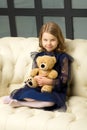 Lovely little girl hugging her teddy bear toy Royalty Free Stock Photo