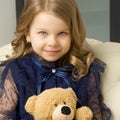 Lovely little girl hugging her teddy bear toy Royalty Free Stock Photo