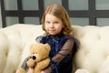 Lovely little girl hugging her teddy bear toy Royalty Free Stock Photo