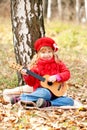 Lovely little girl playing guitar Royalty Free Stock Photo