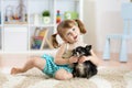 Lovely little girl playing with her pet dog Royalty Free Stock Photo