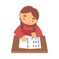 Lovely Little Girl Sitting at Desk and Writing Letters in Notebook, Elementary School Student Learning to Write Cartoon Royalty Free Stock Photo