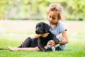 Little girl taking care of her dog and cat Royalty Free Stock Photo