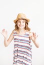 Lovely little girl with straw hat against a white background Royalty Free Stock Photo