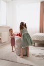 Lovely little girls playing in their room Royalty Free Stock Photo