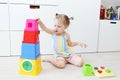 Lovely little 2 years toddler girl playing with educational toy