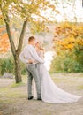 A lovely loving couple, the bride and groom before the wedding gorgeous day, the girl is dressed in a long gray Royalty Free Stock Photo